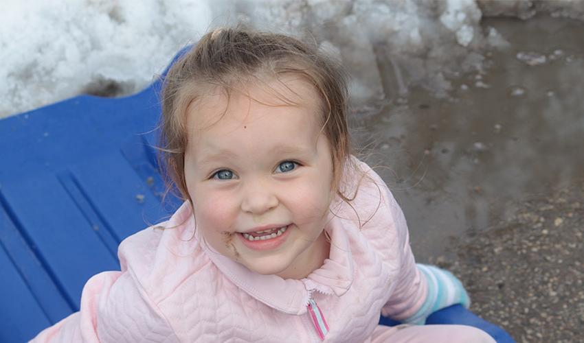 Little girl smiling at the camera