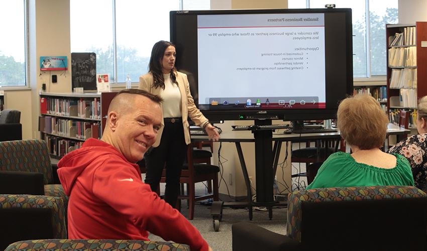 Library employee enjoying the CEWD presentation