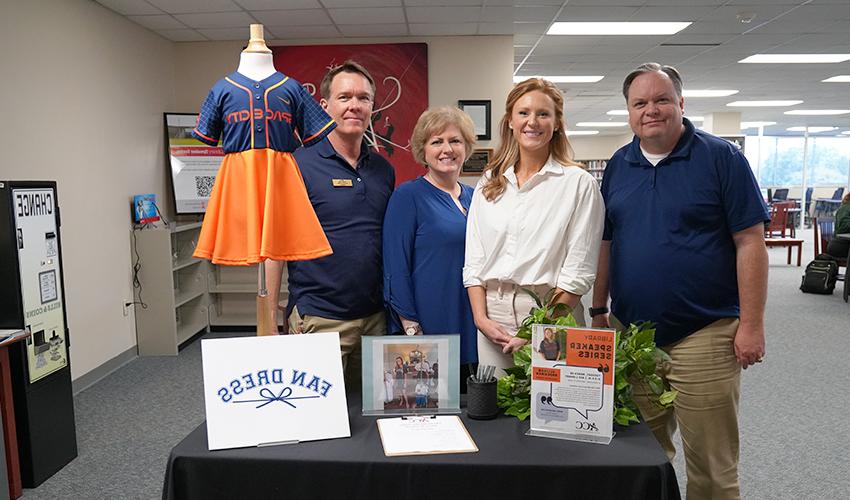 Picture of Allison Brockman with the library staff.