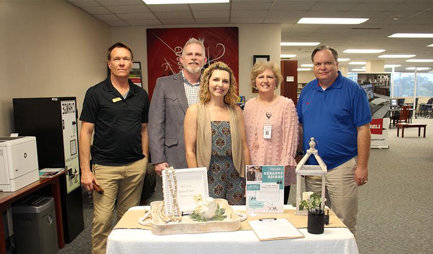 Picture of John and Shannon Moore with the library staff.