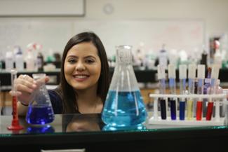 Student working with chemicals in science lab